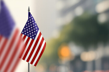 Small flags of USA on a blurred background