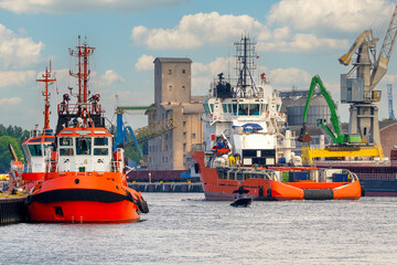 Port of Gdansk, Poland, on the left the Taurus tugboat, a specialized ship servicing drilling platforms, Bazalt II, is sailing