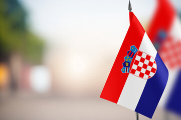 Small flags of Croatia on a blurred background