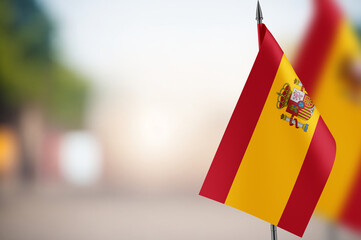 Small flags of Spain on a blurred background