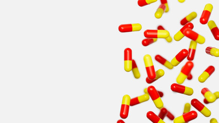 Red orange medicine capsules floatimg against white backdrop with a place for text. Medical research, science concept. 3d render illustration