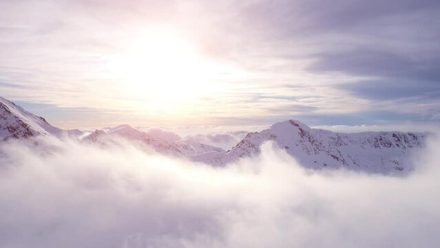 Epic Aerial Flight Through Mountain Clouds Towards Sunrise Beautiful Morning Peaks Inspirational Motivational Nature Background UHD 4K