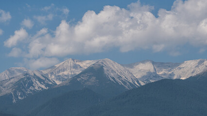 A view of the peaks of the mountains covered with snow