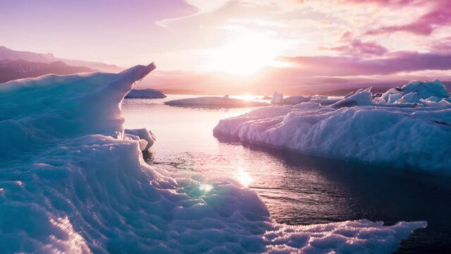 Aerial Drone Flight Over Glaciers Particles Floating In Glacial Lake Sunset Colors Ice Caps Iceland Exploration