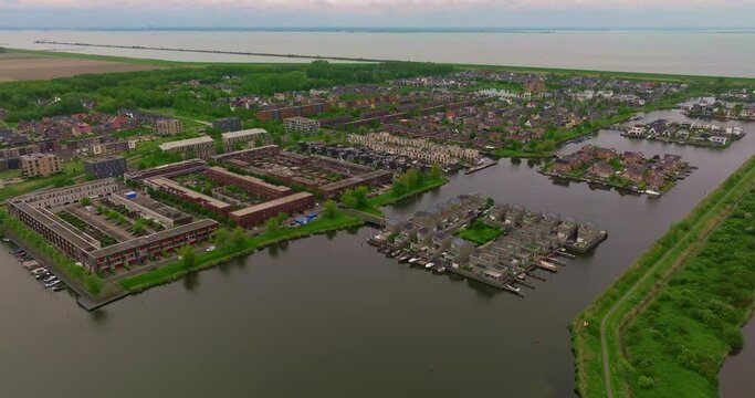 Aerial view of modern suburban area Noorderplassen in Almere, The Netherlands, featuring artificial islands, located on Flevoland polder