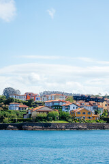 Fototapeta premium Panoramic view of a famous tourist attraction Calo del Moro Beach by the coast in Spain. Beautiful rocky beach with blue water on a sunny day.