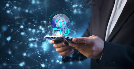 Businessman installing software on a laptop, downloading files, and using cloud storage and data backup services