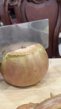 Chrysophyllum cainito Also known cainito, caimito, tar apple, star apple, purple star apple, golden leaf tree, abiaba, pomme de lait Golden leaf tree. Star apple fruits