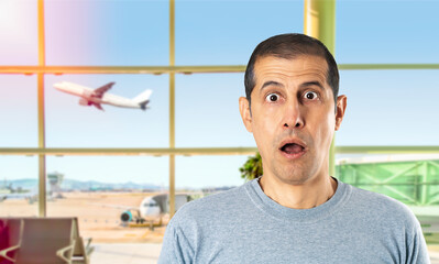 Portrait of a shocked young man at the airport.