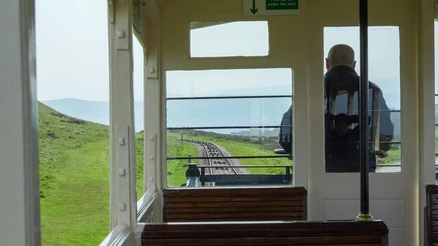 view from on-board a funicular tram on a steep hillside, Great Orme Tramway, Llandudno, Wales
