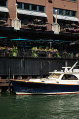 Moored yachts in Chicago against the backdrop of a red brick loft building