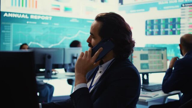 Chief financial officer sharing firm progress on a phone call with the main investor, ensuring performance based on current situation. Administrator works to expand enterprise budget. Camera B.