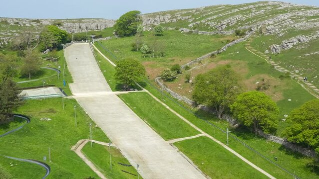 looking down on a dry ski slope from an overhead cable car, Great Orme, Llandudno, Wales