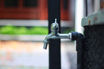 Water faucet on the street, selective focus