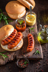 Fat grilled sausage with bun made of pork.