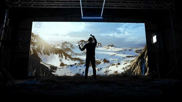Game Designer In Virtual Production Sculpting Digital Landscape Nft Usng Vr Ar Controllers And Gestures Beautiful Virtual Nature Mountains Simulation Cyber Artwork Creation Concept