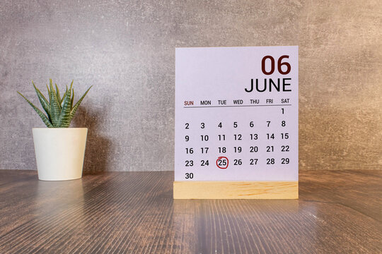 25 june wooden calendar in white background