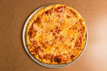 Large plain pizza on a tray