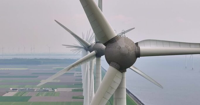 Windmill park green energy from drone view, windmill offshore wind farm in the Netherlands windmill turbines. Windmill farm in the lake the biggest in the Netherlands, sustainable development