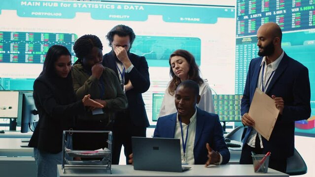 Displeased project manager sharing the failure with his team, employees feeling disappointed and frustrated about unsuccessful partnership. Furious CEO and dissatisfied associates. Camera A.