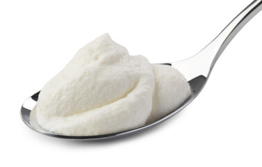 Silver spoon with sour cream isolated on white