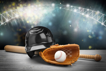 Baseball bat, glove, helmet and ball on wooden table at stadium