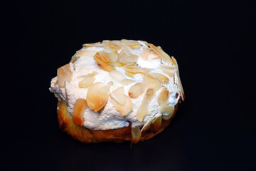 A piece of dessert isolated on black background. French style bakery