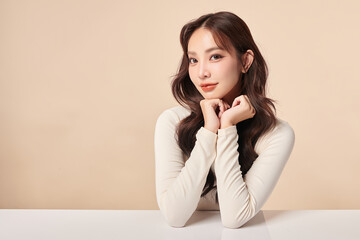 Beautiful young asian woman with clean fresh skin on beige background, Face care, Facial treatment,...