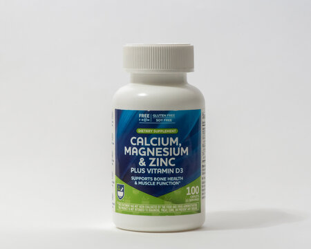Davis, CA, 11 May, 2024. Bottle of Rite Aid Calcium,  Magnesium and Zinc plus vitamin D3, dietary suppement on white background, centered, front view.   