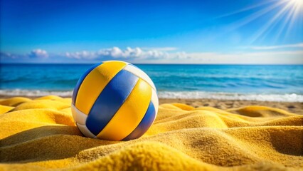 Beach volleyball ball. A yellow, blue and white beach towel is laid out in front of it. 
