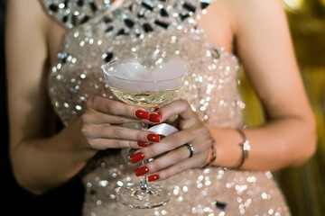 Drinking white wineor champagne during the celebration 