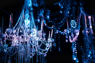 Chrystal chandelier close-up. Glamour background with copy space, selective focus, party...