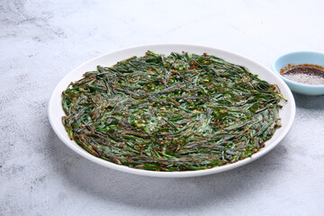 Korean chives pancake against a bright background 밝은 배경에 한국식 부추전
