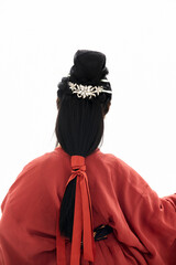 A woman wearing ancient Chinese clothing against a white background.