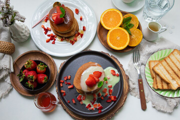 Stack of pancakes hotcakes with honey and strawberries breakfast food american style