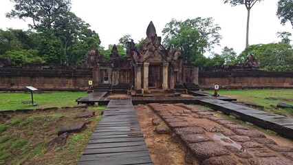 Wide Shot Stabilized Move Towards Ancient Red Sandstone Temple Complex, Angkor, Cambodia