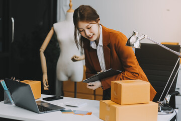 Portrait of Starting small businesses owners female entrepreneurs working on receipt box and check...