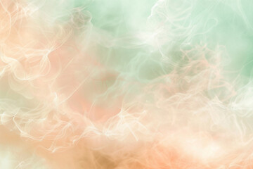 Romantic and dreamy abstract blur in soft peach and mint green tones.