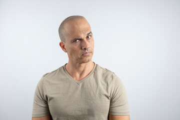 Caucasian, Brazilian man, 48 years old, in the studio showing emotions_serious_1.