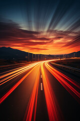 Fototapeta premium Captivating long exposure photo of a highway at sunset, showcasing dynamic light trails against a colorful sky.