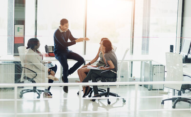 Fototapeta premium Business, people and talking with group in office, teamwork and company vision or coaching discussion together. Meeting, professional and team building with employee, collaboration and brainstorming