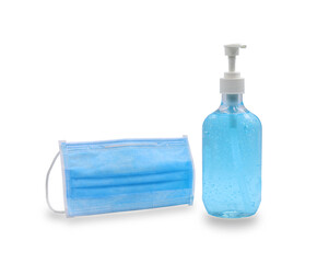 Close up blue alcohol gel hand sanitizer in a clear pump bottle and surgical masks isolated on a...