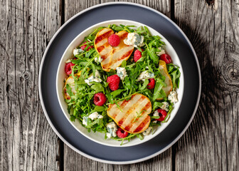 grilled pear salad with cheese, arugula, berries