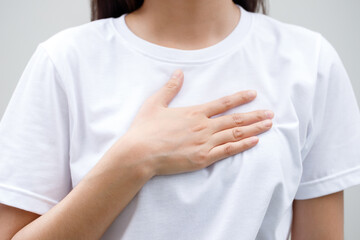 Woman having chest pain while exercising - heart attack. or Heavy exercise causes the body to shock heart disease. may cause life-threatening. health care concep