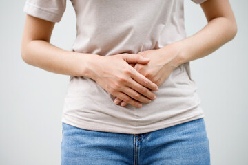 Woman having a stomachache, or menstruation pain. suffering from abdominal. Menstrual cramps....
