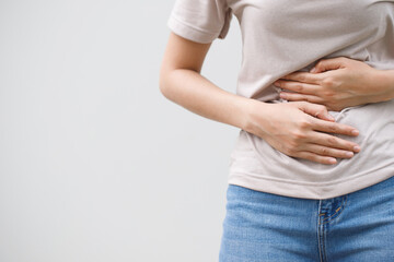 Woman having a stomachache, or menstruation pain. suffering from abdominal. Menstrual cramps. Healthcare and medical, gynecology concept.