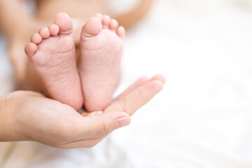 mother and father take care newborn with warmth