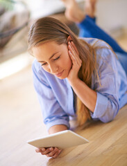 Casual, woman and tablet lying on floor for streaming, social media post or communication in home....