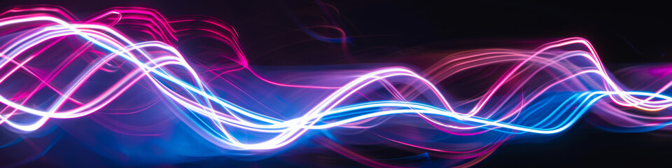 Fototapeta premium A colorful wave of light with purple and blue colors