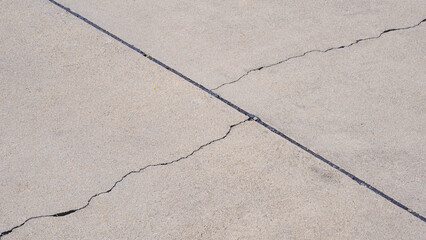 Obraz premium Two crack lines texture on surface of concrete pavement floor background